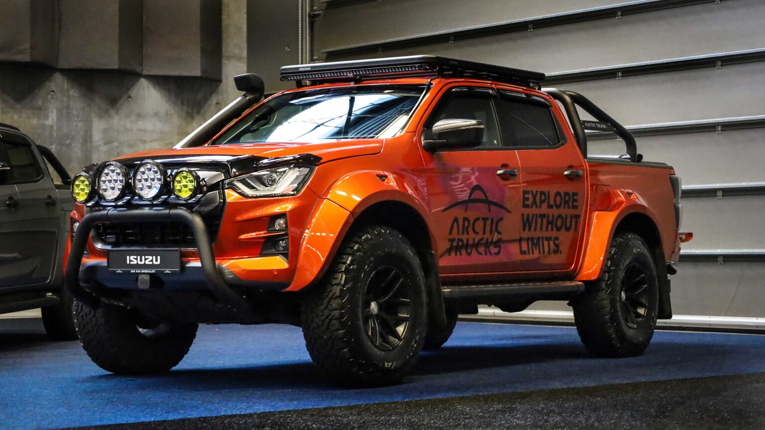 Isuzu pickup truck in front three-quarter view