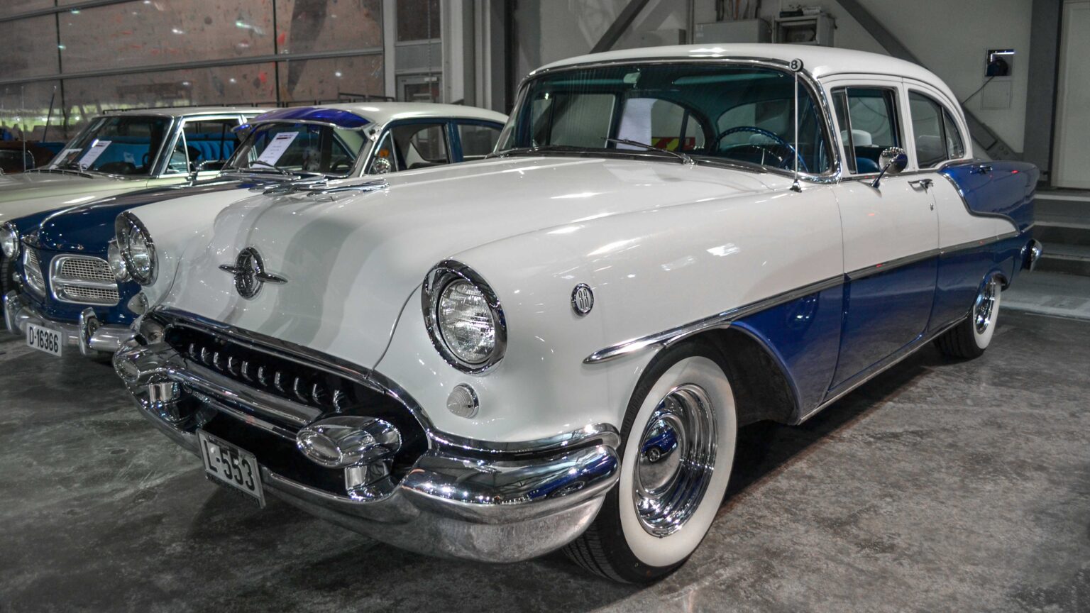 Classic Oldsmobile coupe in front three-quarter view